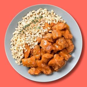 Cabecero de lomo de cerdo con tomate frito casero y guarnición de trigo (400 g.)