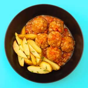 Albóndigas de cerdo ibérico con patatas rústicas (350 g.)